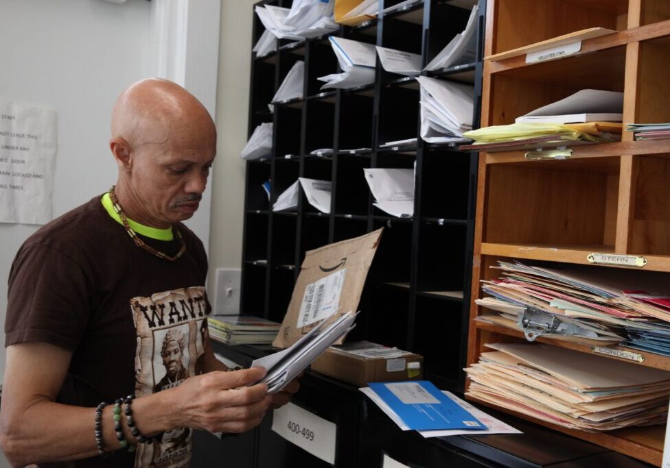 Charles Hopkins doing mail collection and record keeping for incarcerated folks at the VSC office